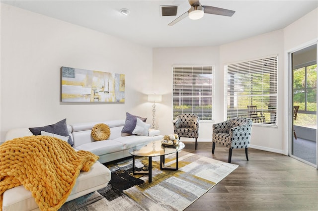 6152 Topsail Rd, Lady Lake, FL 32159 - living area featuring baseboards, visible vents, wood finished floors, and ceiling fan