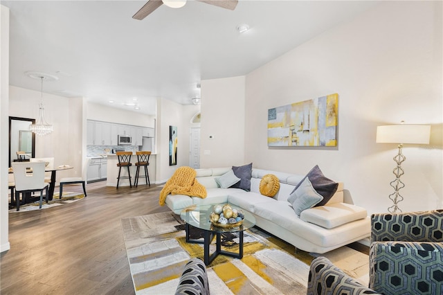6152 Topsail Rd, Lady Lake, FL 32159 - living room with arched walkways, recessed lighting, light wood-style floors, and a ceiling fan