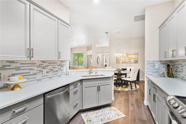 6152 Topsail Rd, Lady Lake, FL 32159 - kitchen featuring light countertops, a sink, stainless steel appliances, and visible vents