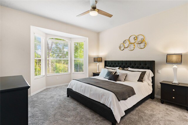 6152 Topsail Rd, Lady Lake, FL 32159 - bedroom with baseboards, a ceiling fan, and light carpet