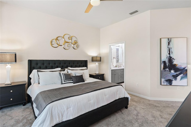 6152 Topsail Rd, Lady Lake, FL 32159 - bedroom with light carpet, ensuite bathroom, baseboards, visible vents, and ceiling fan