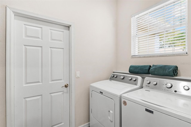 6152 Topsail Rd, Lady Lake, FL 32159 - clothes washing area featuring separate washer and dryer and laundry area
