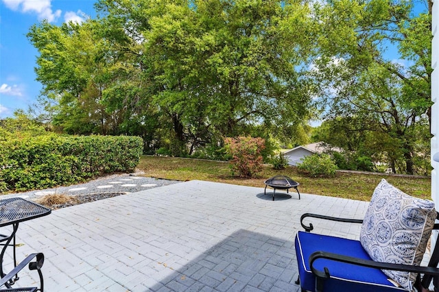 6152 Topsail Rd, Lady Lake, FL 32159 - view of patio / terrace featuring an outdoor fire pit