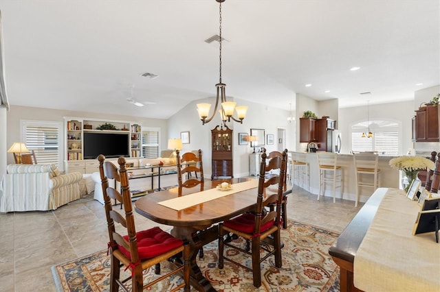 dining area with recessed lighting, visible vents, ceiling fan with notable chandelier, and vaulted ceiling