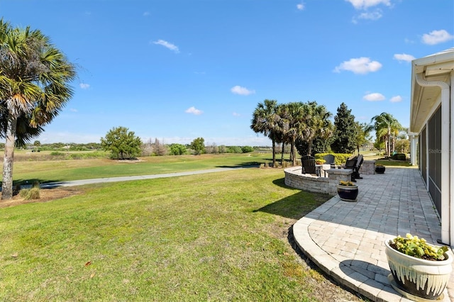 view of yard with a patio and a fire pit