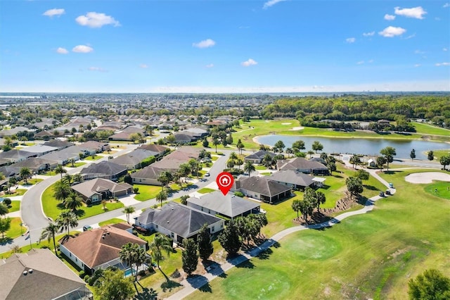 drone / aerial view featuring a residential view and a water view