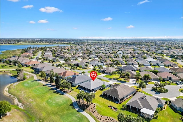 birds eye view of property featuring a residential view and a water view