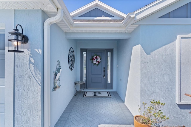 6444 Mcknight Loop, The Villages, FL 34762 - doorway to property featuring stucco siding