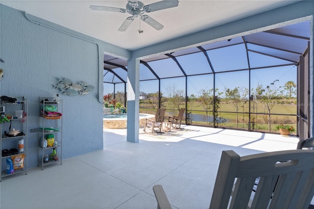 6444 Mcknight Loop, The Villages, FL 34762 - view of patio / terrace with ceiling fan, a pool, a lanai, and a water view