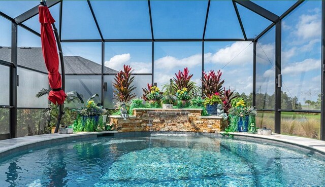 6444 Mcknight Loop, The Villages, FL 34762 - outdoor pool featuring glass enclosure