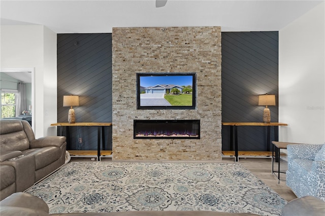 6444 Mcknight Loop, The Villages, FL 34762 - living area featuring a large fireplace and wood finished floors