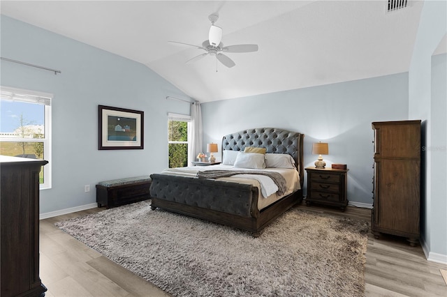 6444 Mcknight Loop, The Villages, FL 34762 - bedroom with vaulted ceiling, light wood-style floors, baseboards, and a ceiling fan