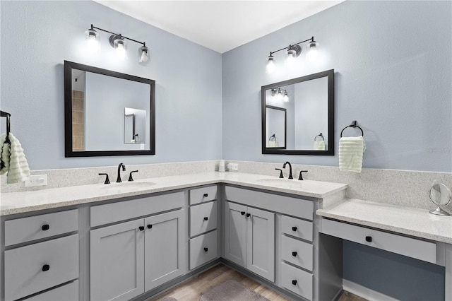 6444 Mcknight Loop, The Villages, FL 34762 - bathroom featuring double vanity and wood finished floors