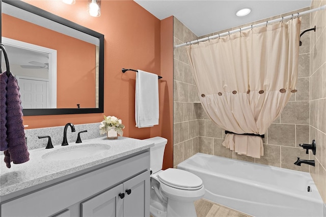 6444 Mcknight Loop, The Villages, FL 34762 - full bathroom featuring shower / bath combination with curtain, vanity, toilet, and wood finished floors