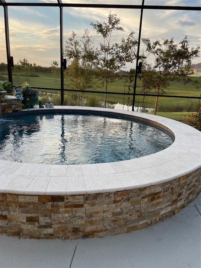 6444 Mcknight Loop, The Villages, FL 34762 - pool at dusk featuring an outdoor pool