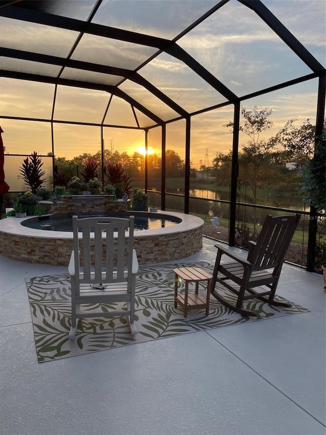 6444 Mcknight Loop, The Villages, FL 34762 - patio terrace at dusk featuring a pool with connected hot tub and a lanai