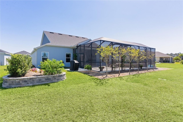 6444 Mcknight Loop, The Villages, FL 34762 - rear view of property with a lawn, stucco siding, a lanai, and a patio