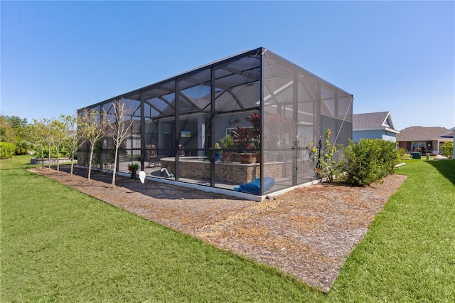 6444 Mcknight Loop, The Villages, FL 34762 - back of property featuring a lawn and glass enclosure