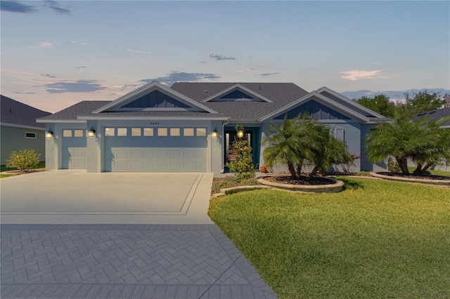 6444 Mcknight Loop, The Villages, FL 34762 - view of front facade with an attached garage, concrete driveway, and a yard