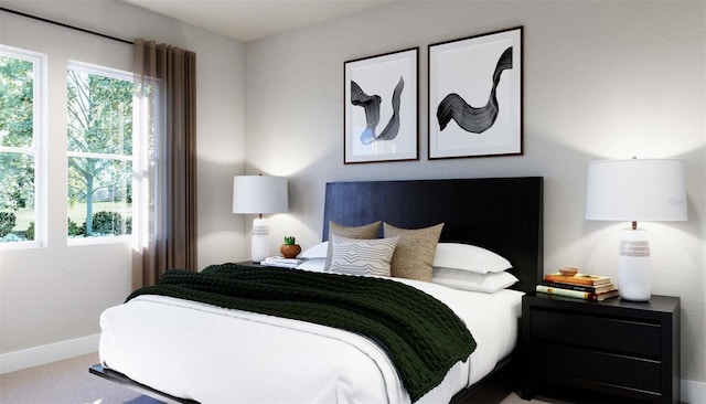 carpeted bedroom with baseboards