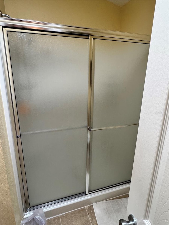 full bath with a shower with door