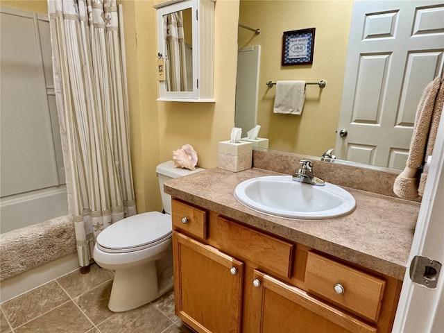 bathroom featuring vanity, toilet, shower / bath combo, and tile patterned flooring