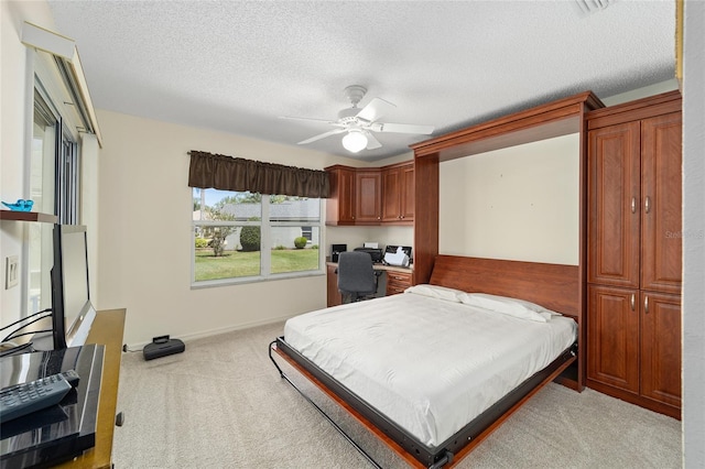 1417 Forest Acres Dr, The Villages, FL 32162 - bedroom featuring baseboards, light colored carpet, a ceiling fan, and a textured ceiling