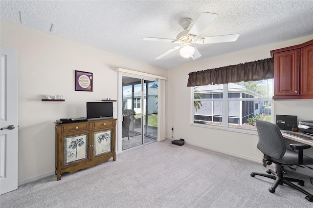 1417 Forest Acres Dr, The Villages, FL 32162 - office with light carpet, baseboards, a textured ceiling, and a ceiling fan