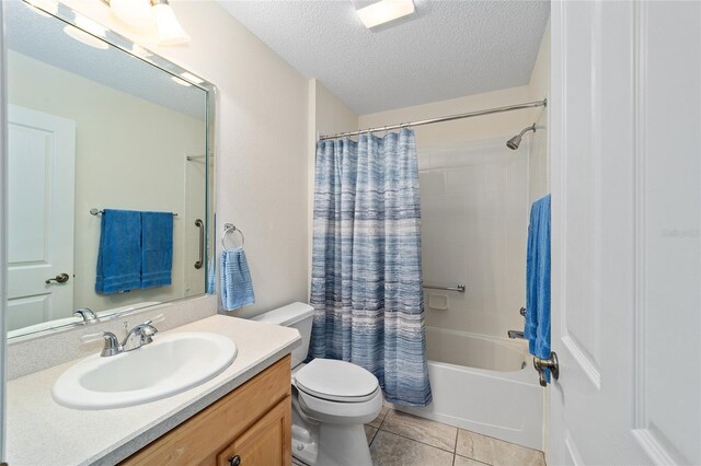 1417 Forest Acres Dr, The Villages, FL 32162 - bathroom featuring shower / bath combo with shower curtain, toilet, vanity, tile patterned floors, and a textured ceiling