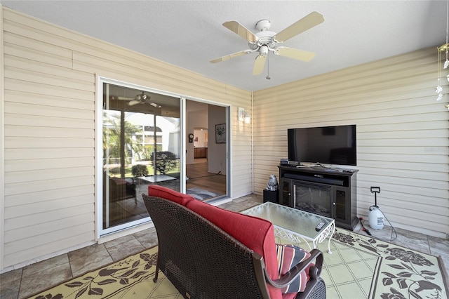 1417 Forest Acres Dr, The Villages, FL 32162 - living room featuring a fireplace and ceiling fan