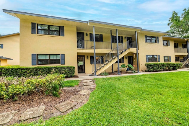 view of property featuring stairway