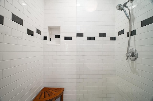 bathroom featuring a tile shower