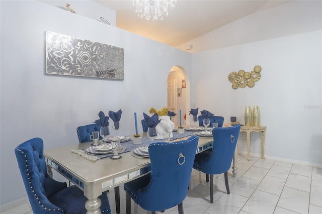 2442 Foxhollow Rd, Tavares, FL 32778 - dining room with arched walkways, baseboards, and a chandelier