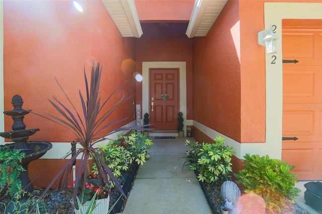 2442 Foxhollow Rd, Tavares, FL 32778 - doorway to property featuring stucco siding