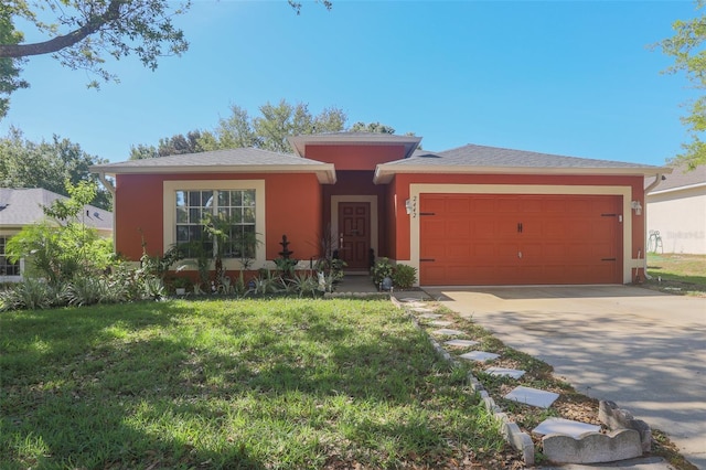 2442 Foxhollow Rd, Tavares, FL 32778 - view of front of house with a front yard, concrete driveway, stucco siding, and an attached garage