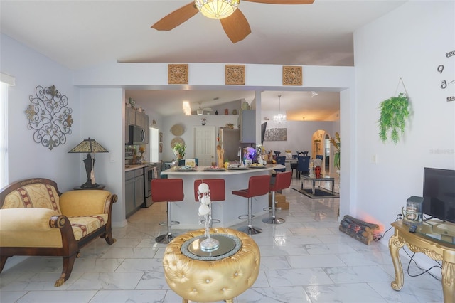 2442 Foxhollow Rd, Tavares, FL 32778 - living room featuring a ceiling fan and marble finish floor