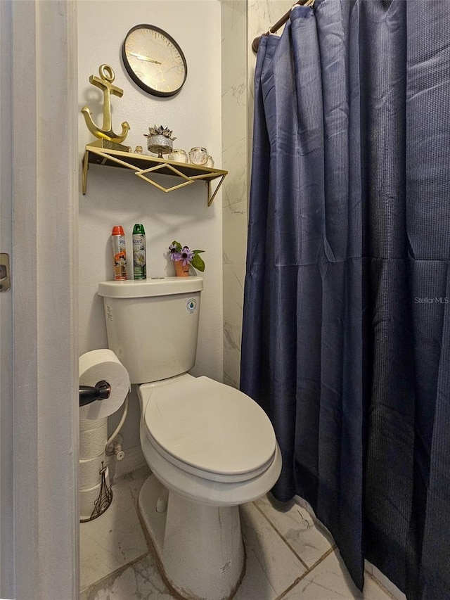 2442 Foxhollow Rd, Tavares, FL 32778 - full bathroom with marble finish floor, toilet, and curtained shower