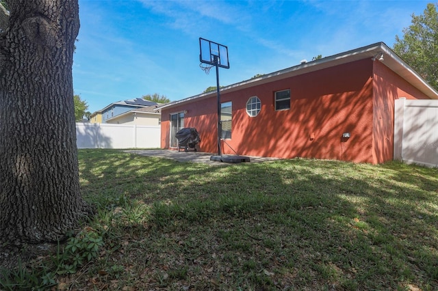 2442 Foxhollow Rd, Tavares, FL 32778 - exterior space with a patio, fence, and a lawn