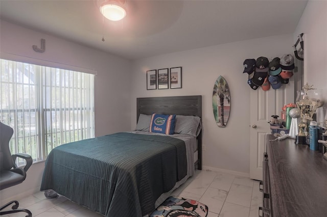 2442 Foxhollow Rd, Tavares, FL 32778 - bedroom featuring marble finish floor, multiple windows, and baseboards