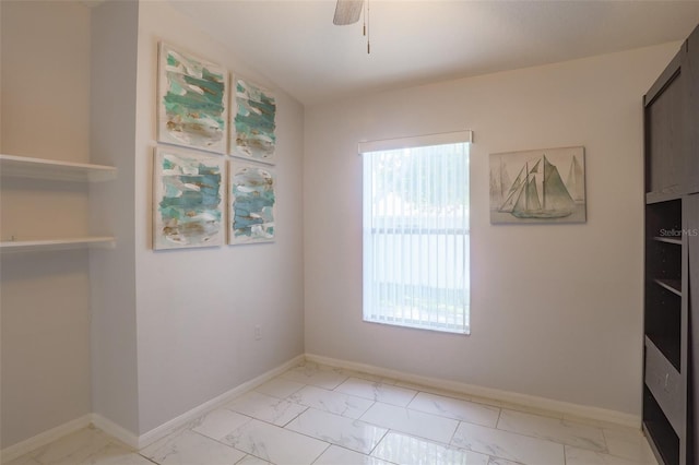 2442 Foxhollow Rd, Tavares, FL 32778 - unfurnished dining area with baseboards, marble finish floor, and a ceiling fan