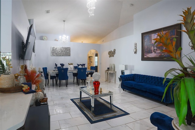2442 Foxhollow Rd, Tavares, FL 32778 - living area with high vaulted ceiling, visible vents, marble finish floor, arched walkways, and an inviting chandelier