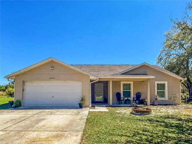 ranch-style house featuring an attached garage, concrete driveway, a front lawn, stucco siding, and roof with shingles