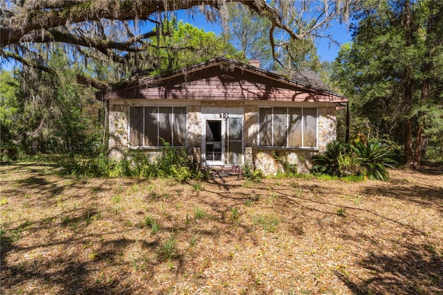 801 Kilgore St, Wildwood, FL 34785 - back of house with a sunroom