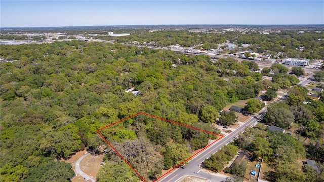 801 Kilgore St, Wildwood, FL 34785 - drone / aerial view featuring a view of trees