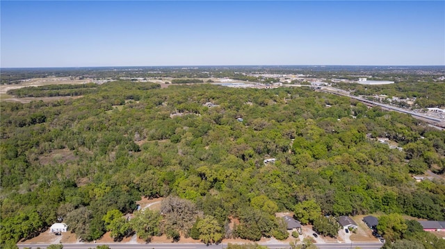 801 Kilgore St, Wildwood, FL 34785 - drone / aerial view with a wooded view