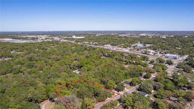 801 Kilgore St, Wildwood, FL 34785 - birds eye view of property with a wooded view