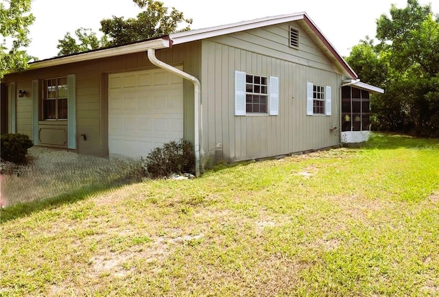 view of property exterior featuring driveway, a garage, and a yard