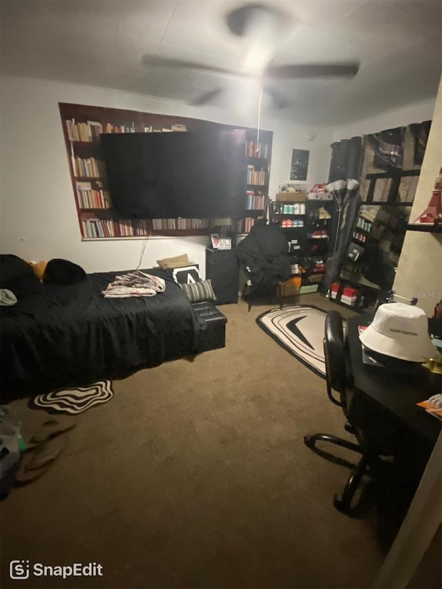 bedroom with a ceiling fan and carpet floors
