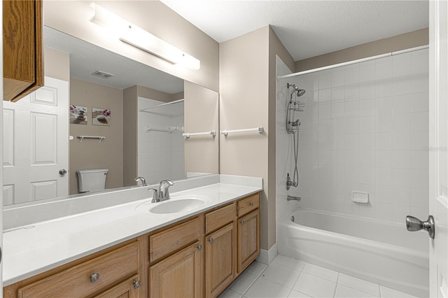 full bathroom featuring visible vents, a textured ceiling, shower / washtub combination, tile patterned flooring, and vanity