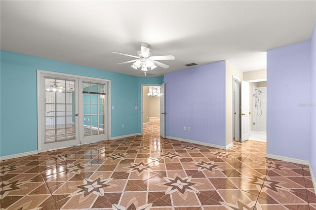 unfurnished room featuring visible vents, french doors, baseboards, and ceiling fan